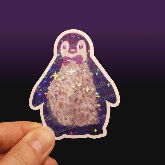 Glitzer Sticker Pinguin Oskar in blau-lila-grau, gemalt mit Acrylfarben.